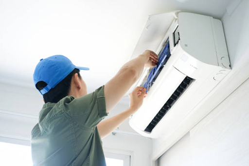 AceComfort technician servicing ductless heat pump Vancouver